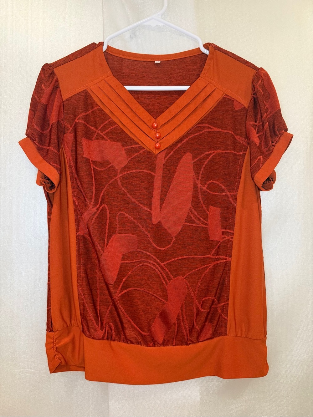 Burnt Orange Abstract Panel Short Sleeve Pleated V-Neck Blouse with Button Trim